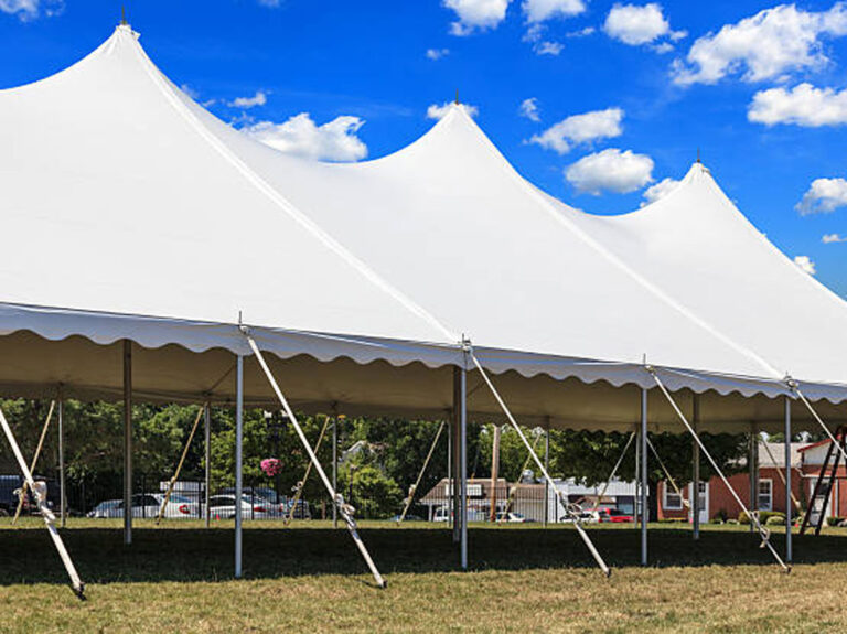 A large white tent set up for an outdoor event