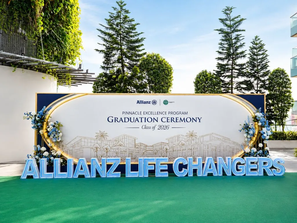 Custom-printed graduation ceremony backdrop with floral arch and green carpet in Singapore